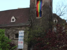 The banner hung by the group Christus Vincit from St. Rupert’s Church in Vienna, Austria.